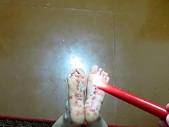 A mature couple's homemade foot fetish with tickling and wax play
