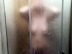 Hidden camera captures milf's steamy shower session