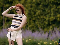 Heidi Romanova, a stunning redheaded beauty, enjoys a nude golf game