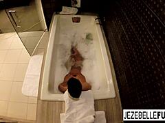 Jenzebelle bond's big tits bounce as she takes a bath
